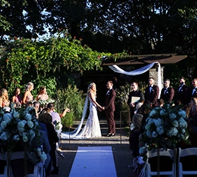 A couple at an outdoor wedding ceremony